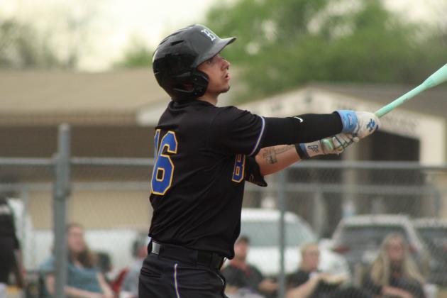 Bethel senior Weston Henry gets a hit, before being hit by the ball and walking, during the April 3 game at Tecumseh.