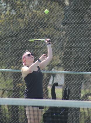 Tecumseh junior Savannah Wootten serves during the Tecumseh Tennis Tournament on March 30. Wootten and Hannah Tidwell, also a junior, on #2 Doubles placed second, and the #1 Doubles team of Kalyn Bartmess and Maggie Johnson placed fourth. The Lady Savages tennis team placed first.