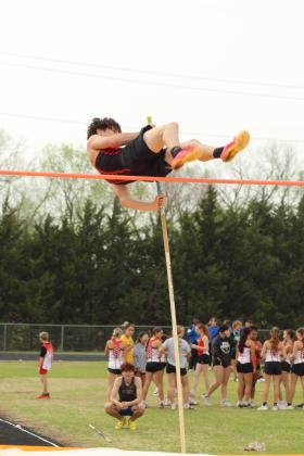 McLoud junior Tripp Bishop clears the pole vault during the Tecumseh Track Meet on March 31.