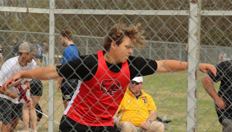 North Rock Creek eighth-grader Kason Johnston winds up in the discus competition of the Tecumseh Track Meet on March 31.