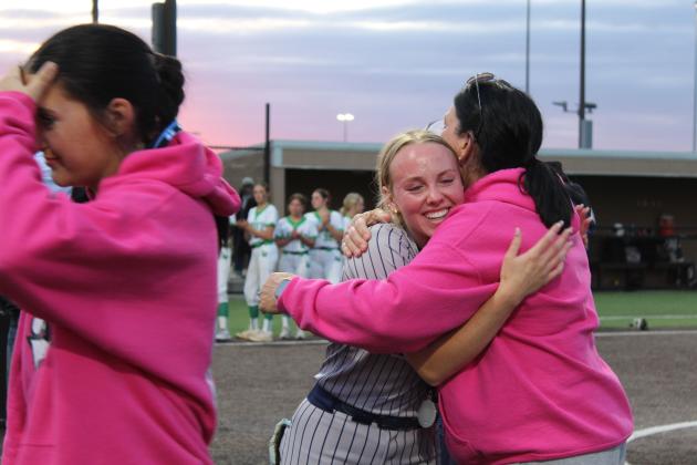 Asher senior, pitcher Preslee Taylor gets a hug from Head Coach Tari Dubler after receiving her medal at the Class B Slow Pitch State Championship, held at FireLake Ball Fields on May 6. The Lady Indians won two games and lost one in the state tournament to become state runner-up.
