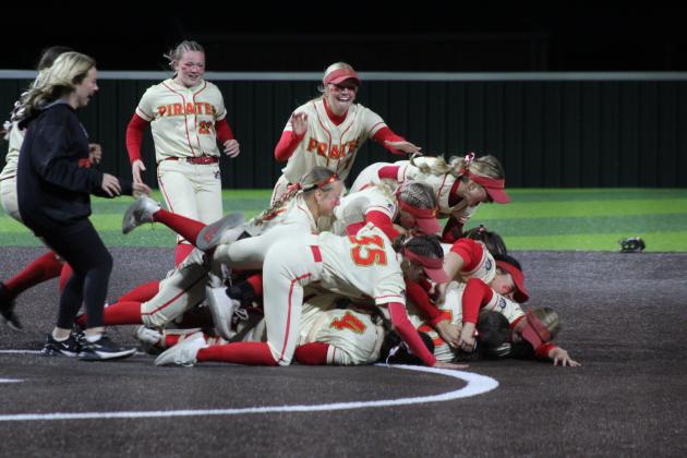 The Dale Lady Pirates celebrate with a dogpile after winning the Class 4A Slow Pitch State Championship at FireLake Ball Fields on May 5. The Lady Pirates narrowly beat Silo, 18-17, as well as Coalgate, 14-5, and Howe, 15-0. They end their season with a record of 39-4. See next week's Countywide &amp; Sun (May 14, 2026) for the full story and more photos. Natasha Dunagan, Countywide &amp; Sun