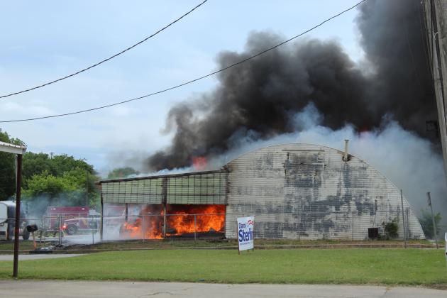 Tecumseh firefighters work to put out a fire at Jordan Contractor's mechanic barn in downtown Tecumseh on May 6. Natasha Dunagan, Countywide &amp; Sun