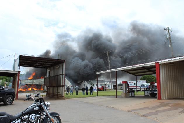 A fire in the Jordan Contractors, LLC mechanic barn, at the corner of Maple and 4th streets, sent black smoke over downtown Tecumseh on May 6. Firefighters from Tecumseh, Shawnee, Earlsboro and Bethel had the blaze mostly extinguished in about 30 to 45 minutes, despite explosions possibly caused by drums of used motor oil and acetylene tanks. Police Chief JR Kidney advised residents on social media to stay indoors to avoid breathing the fumes. Cheyanna Dietz, Countywide &amp; Sun Intern