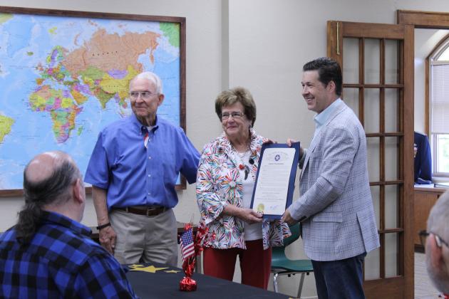 Oklahoma State Senator Shane Jett, far right, presents a Senate Citation of Commendation to Bill and Nancy Ford in honor of the Pottawatomie County Educational Veterans Museum, in Shawnee, on May 25 during the Gold Star Families Reception at the museum. B. Ford is a Korean War veteran, and N. Ford lost her father in WWII.