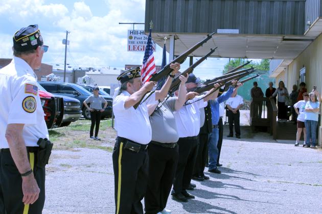 The Tecumseh American Legion Post 260 Honor Guard, led by Post Sergeant-at-Arms Henry Watters, far left, gives a 21-gun salute during their Memorial Day ceremony on May 25.