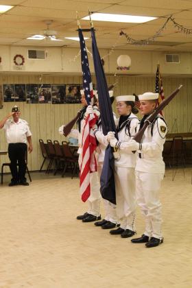 The U.S. Naval Sea Cadet Color Guard retire the colors, as Tecumseh American Legion Post 260 Commander Tom Snodgrass salutes during the Memorial Day ceremony on May 25. Shown, from left, are PO2 Joeby Komppa, PO2 Zachary Hastings, PO1 Diana Murray and SA Gabriel Synakowski.