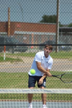 Shawnee senior Benji Cole keeps his eyes on the ball during the Shawnee NGB Tournament, held at SHS and OBU on May 2. Cole competed in #1 Doubles with senior Bryce Comstock.