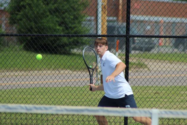 Shawnee senior Benji Cole keeps his eyes on the ball during the Shawnee NGB Tournament, held at SHS and OBU on May 2. Cole competed in #1 Doubles with senior Bryce Comstock.