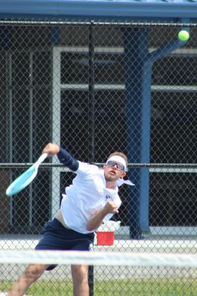 Shawnee senior Carter Schollenbarger serves in #1 Singles during the Shawnee NGB Tournament, held at SHS and OBU on May 2.