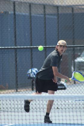Tecumseh senior Eli Mullins watches the ball's path during the Shawnee NGB Tournament, held at SHS and OBU on May 2. Mullins played on #1 Doubles with Xzavier Kommer.