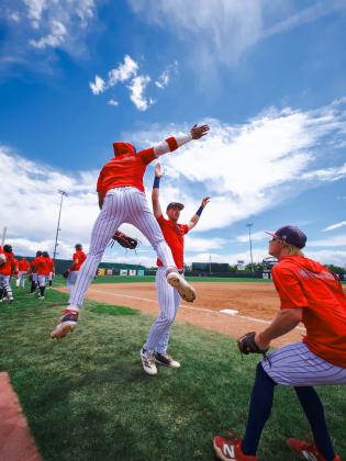 Cohl McCoy of Fort Worth, Texas, left, and Dylan Restine of Panama, right, celebrate with Brayden Harpole of Burkburnett, Texas, center, during the JUCO World Series. Photos Provided