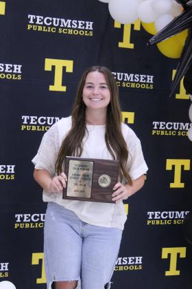 Senior Maggie Wilson poses with her Savage Pride Female Athlete of the Year during the Tecumseh High School Athletic Awards on May 18.