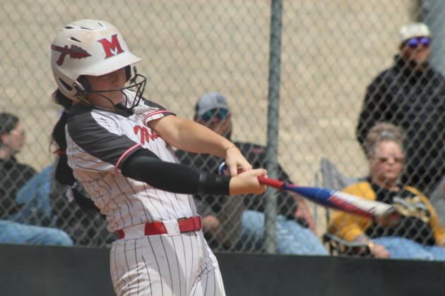 McLoud junior Miley HIcklin hits a double during the April 29 Class 5A Slow Pitch Regional Tournament game at Tecumseh.
