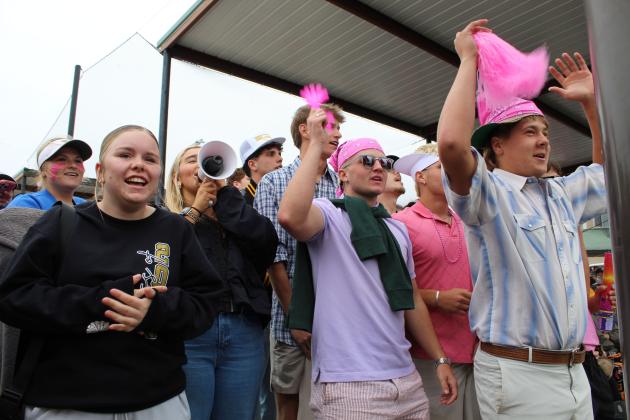 The Tecumseh High School student section cheers for the Lady Savages at the Class 5A Slow Pitch Quarterfinal game against Elgin on May 5.