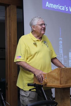 Pottawotomie County Veterans Educational Museum and Law Library Director and Vietnam Veteran Douglas Warden introduces his friend retired Brig. Gen. Ben Robinson on June 11.