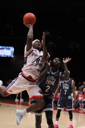 Potawatomi Fire Forward KD Moore aims for a basket and gets the foul in the fourth quarter. Moore scored 19 points and nine rebounds and had two assists and three steals. The Fire won this game, 125-110, after taking the first game on June 18, 151-114. Photos by Natasha Dunagan, Countywide & Sun