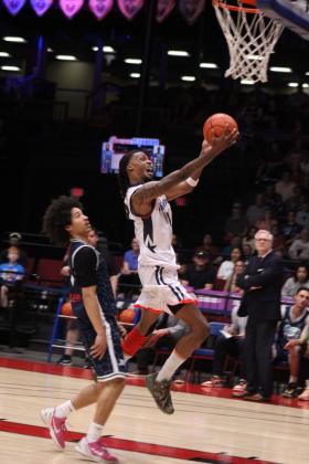 Potawatomi Fire Forward Ricky Artis II takes it to the hoop in the first quarter. Artis led the scoring with 25 points, five rebounds and two assists.