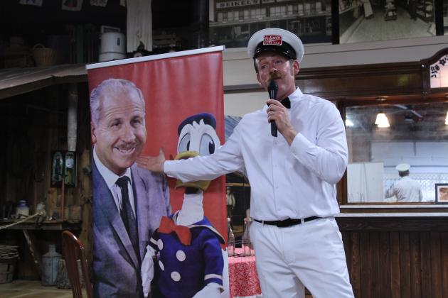 Nick Waters with American Storytellers, LLC, speaks about Clarence "Ducky" Nash, the voice of Donald Duck for 50 years, at the McLoud Library program, held at the McLoud History Museum on June 8. See extended caption following the article.