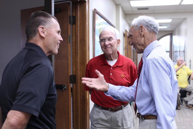Brothers Bill and Bob Ford speak with Sheriff Freeland Wood.