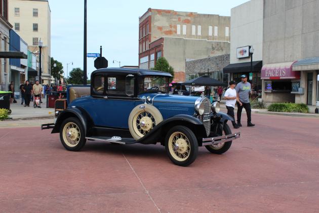 Steve Collins steers his 1930 Ford Model A onto Main Street before finding a place to park at "Rides and Rods" on June 18 in Downtown Shawnee. Collins said the car belonged to his grandfather, Joe Scheidt, and Scheidt did most of the restoration and drove it in parades and at festivals. According to the "Rides &amp; Rods Shawnee Oklahoma" Facebook page, there were about 20 to 30 hotrods on Main Street and lots of motorcyles along Bell Avenue. This event happens on the third Thursday each month, April-Oct.