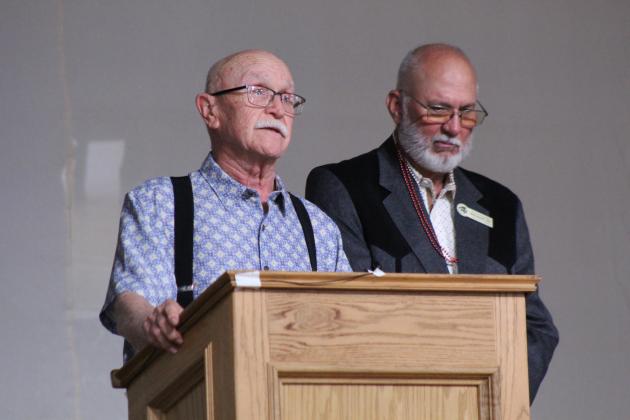 Tecumseh Alum Dwight Wise, left, who traveled from Amarillo, TX, speaks before giving the benediction, as THS Alumni Association President Craig Rodgers stands by, at the 124th Annual Alumni Banquet on May 30. Wise graduated in 1961, owned a Phillips 66 station on Broadway for more than 30 years and oversaw the implementation of Tecumseh's 911 system, said Alumni Recording Secretary Mary Carter in an email.