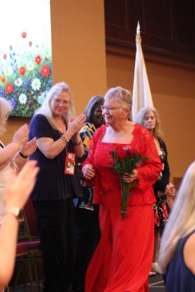 Donna Snodgrass is applauded as she walks onstage before being sworn in as the Department of Oklahoma American Legion Auxiliary President.