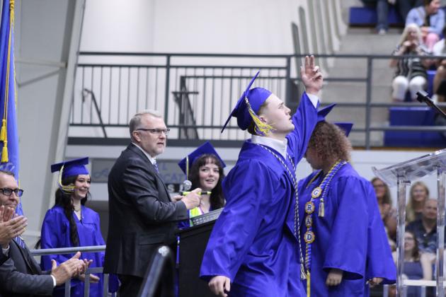 Gavin Shaw does a dance before receiving his diploma at the Bethel High School Graduation, held on May 16 in the BHS gym.
