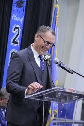Retiring Bethel Superintendent Dr. Matt Posey introduces Bethel High School Teacher Amanda Brock during graduation, held at the BHS gym on May 16. Bethel graduated 81 seniors this year.
