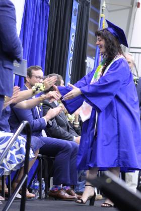 Kodee Wilkerson is congratulated by the Bethel School Board at the Bethel High School Graduation, held on May 16 in the BHS gym.