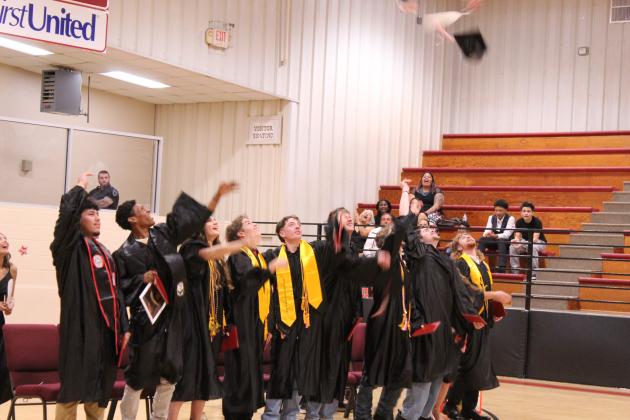 The 2026 Class of Earlsboro High School tosses their caps after receiving their diplomas on May 8.