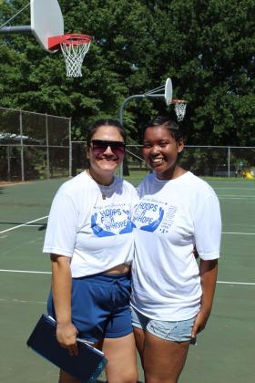 Best friends Isabella McCoy and J-Lynn Haymond, both of Shawnee, pause for a photo before starting their First Annual Hoops for Hope fundraiser.