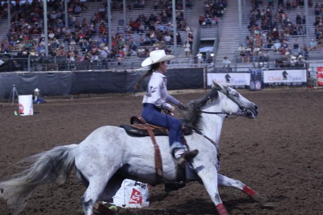 Brenna Beauchamp of Wanette rounds the third barrel in the barrel racing event of the International Finals Youth Rodeo (IFYR) on July 12.