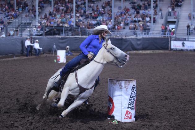 Cassidy Wilson of Shawnee leans into the third barrel in the barrel racing event of the International Finals Youth Rodeo (IFYR) on July 12.