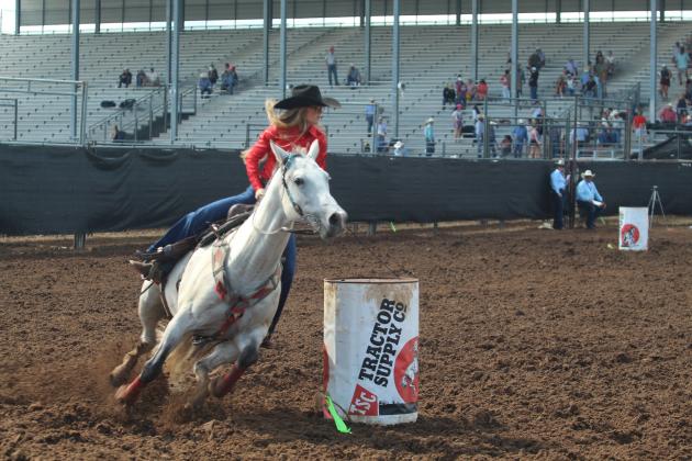 Kinzlee Jones of Shawnee looks ahead from the last barrel in the barrel racing event of the International Finals Youth Rodeo on the morning of July 13.