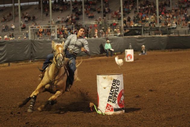 Gabby Palermo of Bullard, TX, loses her hat while circling the third barrel in the barrel racing event of the International Finals Youth Rodeo on the evening of July 13.