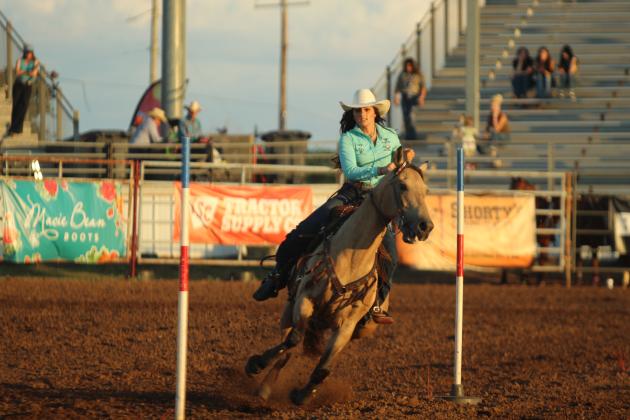 Cassidy Wilson of Shawnee navigates through the poles in the pole bending event of the International Finals Youth Rodeo on the evening of July 13.