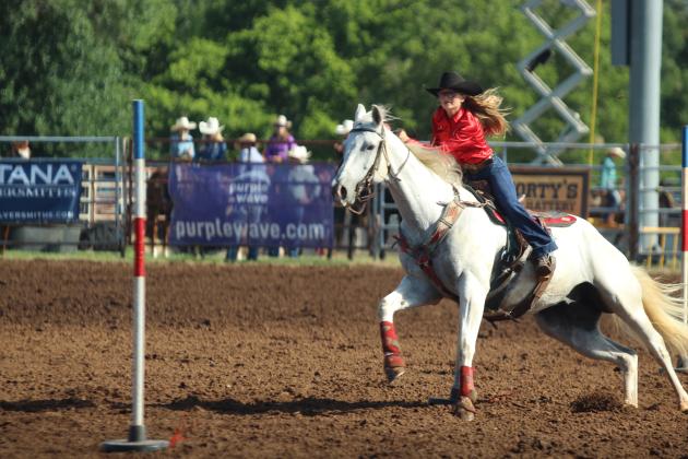 Kinzlee Jones of Shawnee concentrates on the next pole in the pole bending event of the International Finals Youth Rodeo on the morning of July 13.