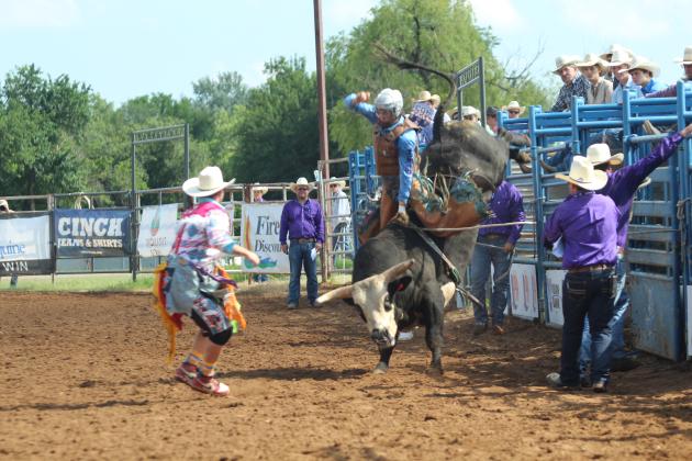Cohen Haydel of Prairieville, LA, tries to balance as his bull launches from its chute in the bull riding event of the International Finals Youth Rodeo at the Heart of Oklahoma Expo Center on the morning of July 14.
