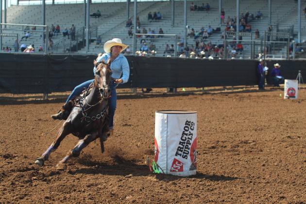 Danni Brown of Bethel rounds the third barrel at the IFYR and gets a time of 17.334 for her first run of the rodeo on the morning of July 14.