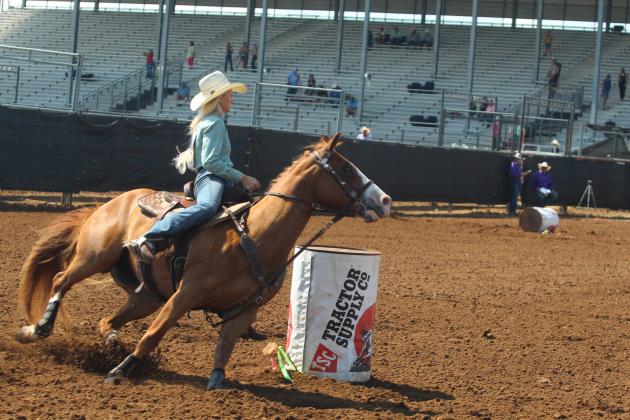 Juel Ross of McLoud looks for the finish line during her barrel race in the IFYR on the morning of July 14.