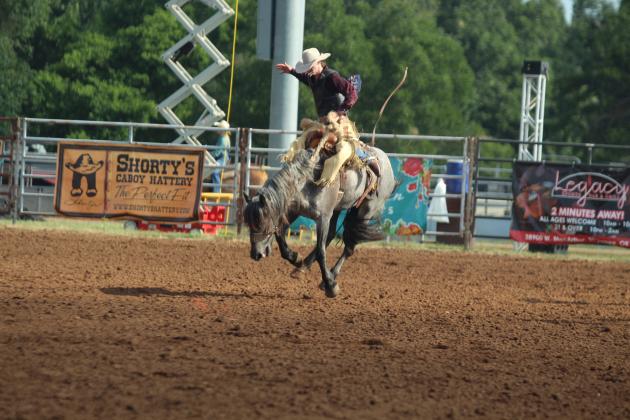 Jack Crews of St. Cloud, FL, competes in the saddle bronc event of the International Finals Youth Rodeo on the morning of July 14.