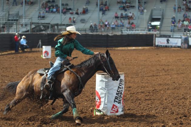 Sydney Johnson of Tecumseh rounds the final barrel during the IFYR on the morning of July 16. Johnson took seventh place in the final barrel racing standings.