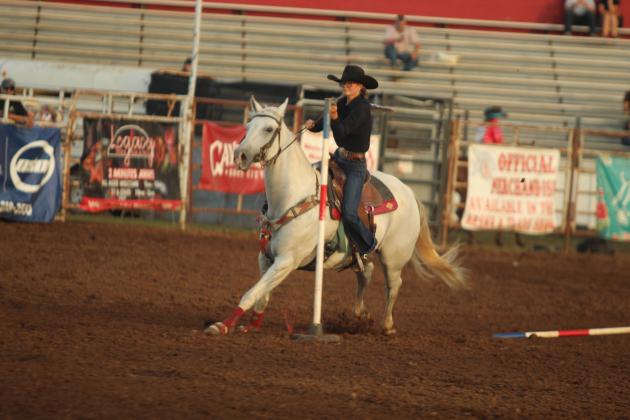 Kinzlee Jones of Shawnee weaves around the poles during the IFYR on the evening of July 16.