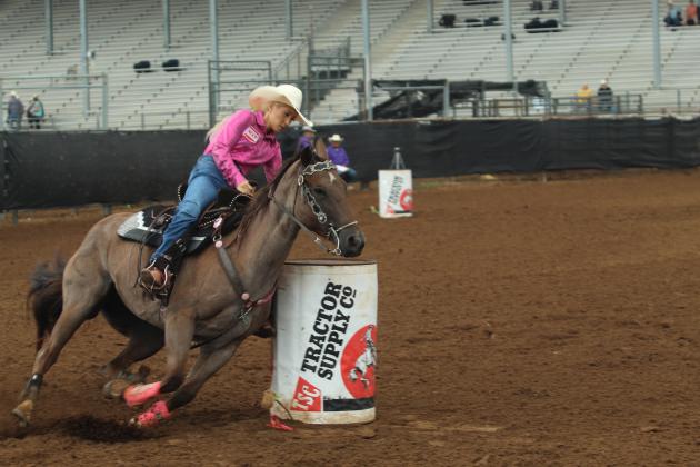 Brayle Miller of McLoud makes a tight turn in the barrel racing during the IFYR on the morning of July 17.