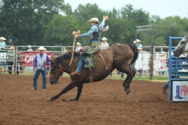 Caden Mayberry of Oklahoma City, OK, competes in the saddle bronc event of the IFYR on the morning of July 17.