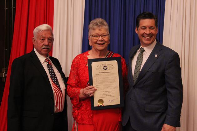 Tom and Donna Snodgrass pose with State Senator Shane Jett after Jett presented D. Snodgrass with a Certificate of Commemoration.