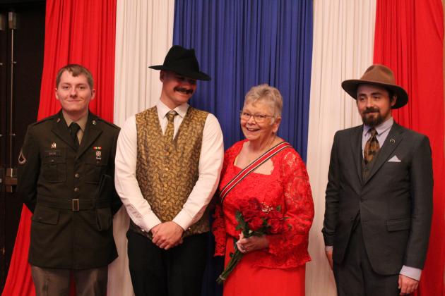 Donna Snodgrass poses with former U.S. Naval Sea Cadets Andrew Bacon, Army National Guardsman; Roman Baker, Navy veteran; and Ian Baker, Navy veteran.