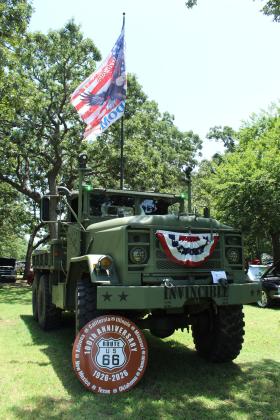 A 1984 AM General Five-ton truck, owned by Jay Kreft of Shawnee, was decorated with a 250th USA anniversary "Freedom" flag, US bunting and a Route 66 100th anniversary sign at the 39th Annual Knights Auto Club Car Show at Boy Scout Park on June 27. Kreft took Mayor's Choice with his military truck out of 151 entries and six club cars.