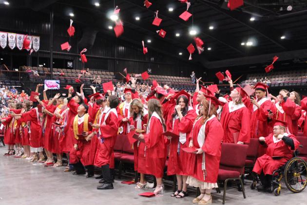 The McLoud High School Class of 2026 tosses their caps after receiving their diplomas on May 23 at FireLake Arena. There were 92 seniors who graduated from McLoud this year.